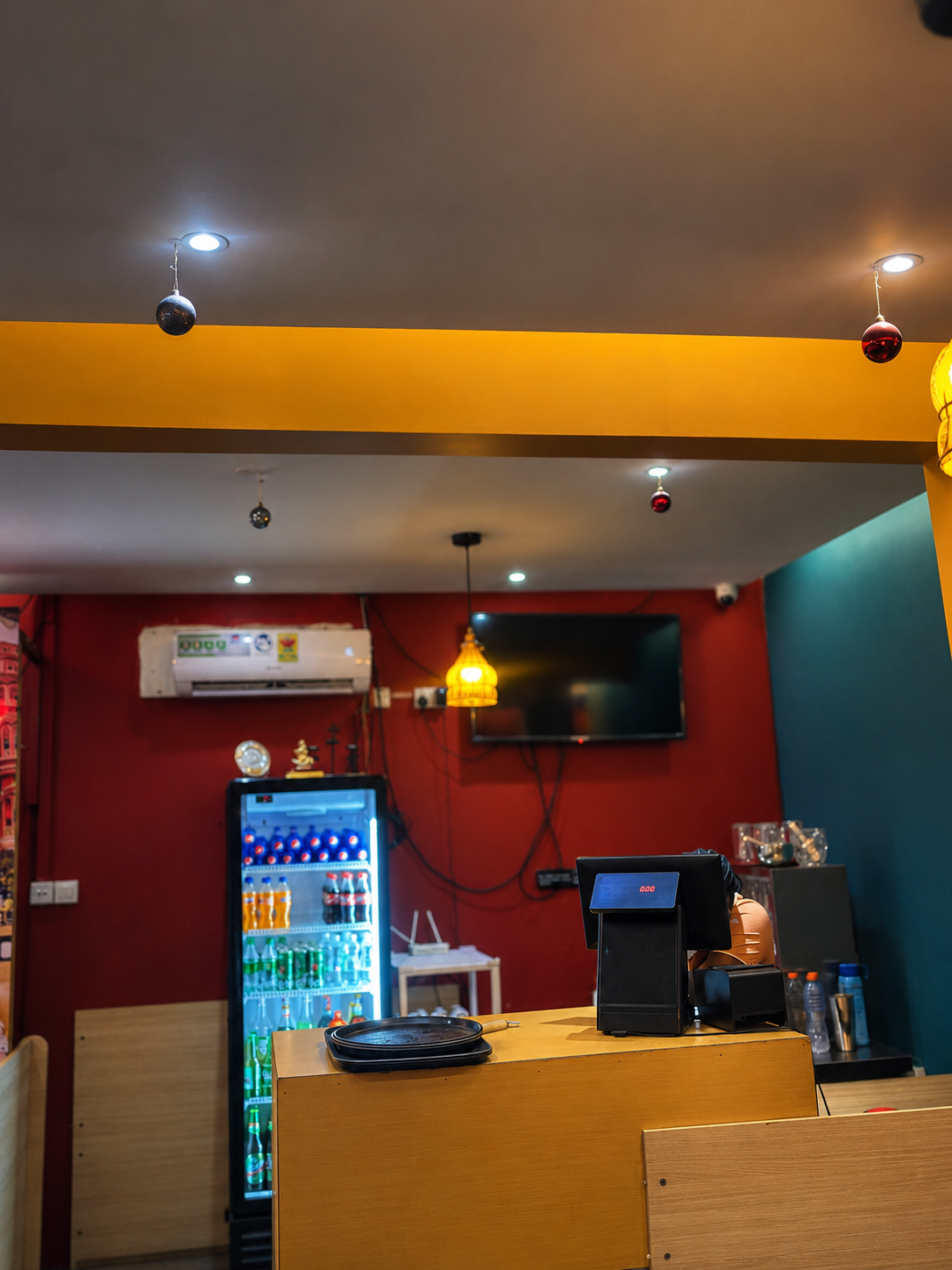 The counter and drink fridge at Chilli Ji